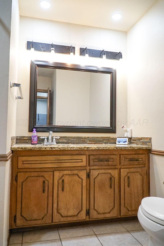 8403 Whittier Dr, Amarillo, TX 79110 - bathroom featuring vanity, toilet, and tile patterned flooring