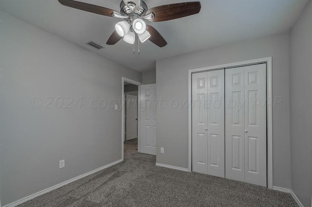 unfurnished bedroom featuring carpet flooring, a closet, and ceiling fan