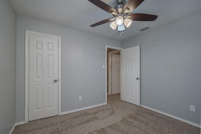 unfurnished bedroom featuring ceiling fan and carpet floors