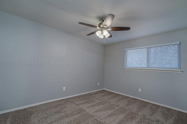 empty room featuring carpet floors and ceiling fan