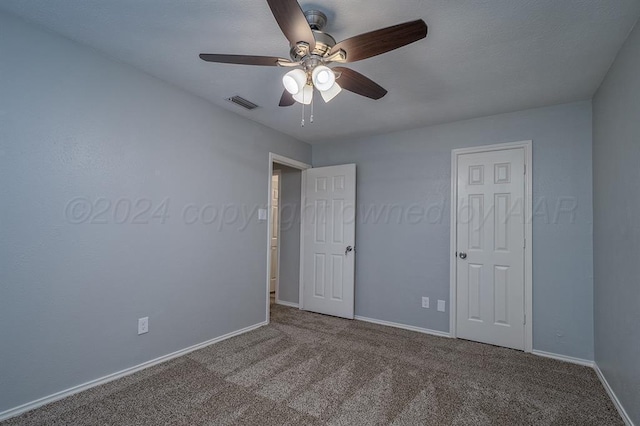 unfurnished bedroom with carpet and ceiling fan