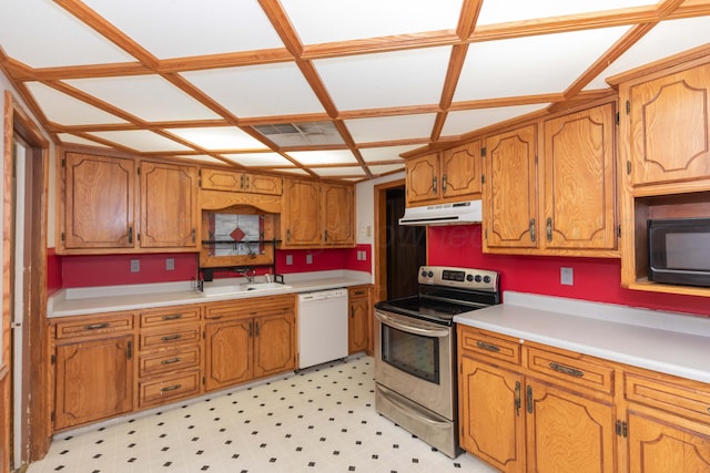 507 Aaron Rd, Fritch, TX 79036 - kitchen featuring under cabinet range hood, dishwasher, stainless steel range with electric cooktop, and brown cabinetry