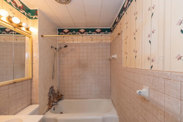 507 Aaron Rd, Fritch, TX 79036 - bathroom with tile walls, toilet, and tub / shower combination