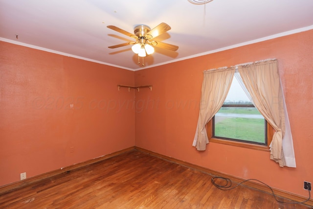 507 Aaron Rd, Fritch, TX 79036 - empty room with a ceiling fan, ornamental molding, baseboards, and wood finished floors