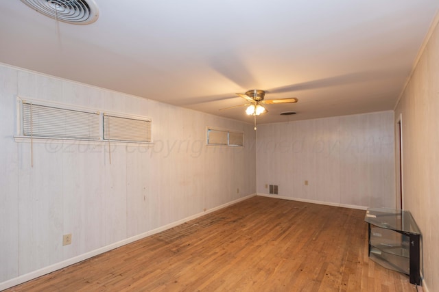 507 Aaron Rd, Fritch, TX 79036 - below grade area with a ceiling fan, visible vents, and wood finished floors