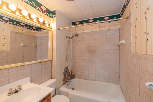 507 Aaron Rd, Fritch, TX 79036 - bathroom featuring vanity, tile walls, shower / washtub combination, and toilet