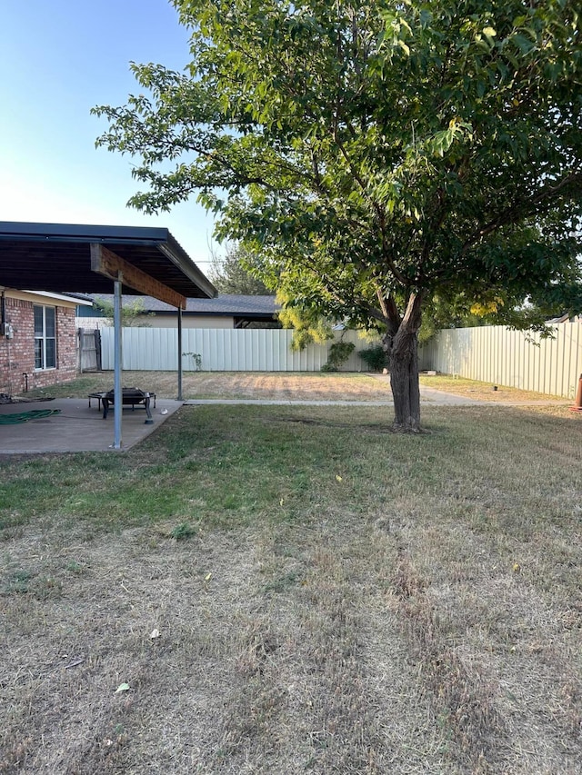 view of yard featuring a patio and fence