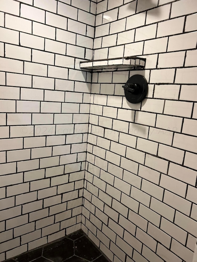 bathroom with tiled shower