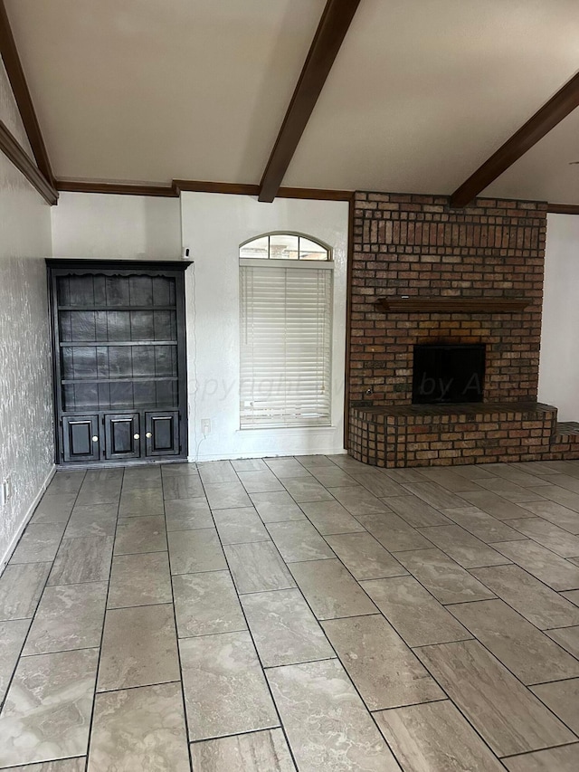 unfurnished living room with lofted ceiling with beams and a brick fireplace