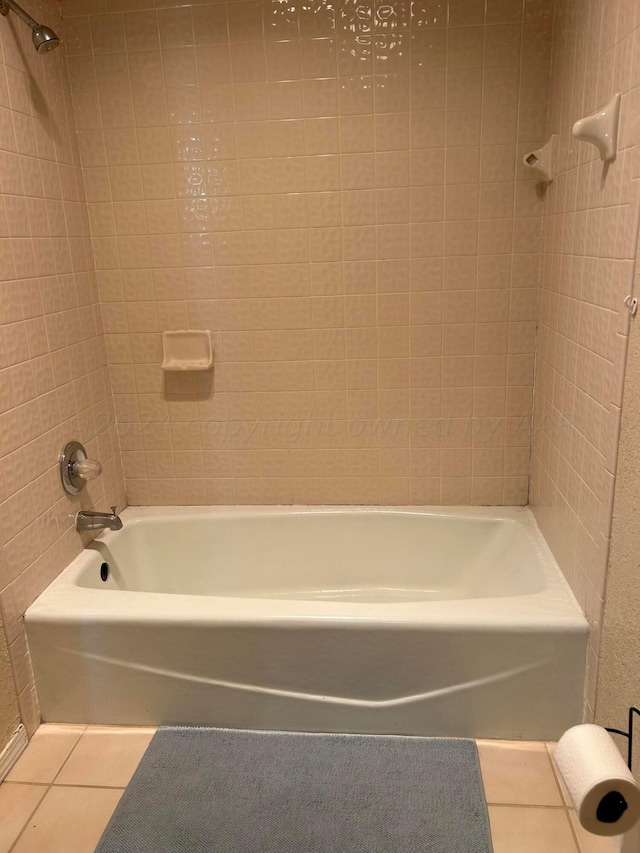 full bath with tile patterned floors and shower / tub combination