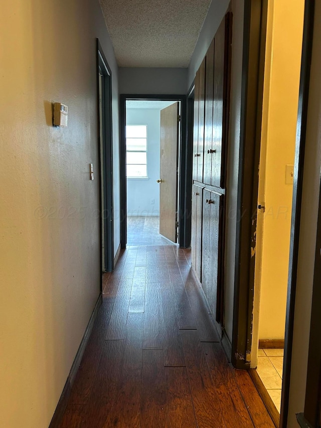 2914 Detroit St, Amarillo, TX 79103 - corridor with dark wood-type flooring and a textured ceiling