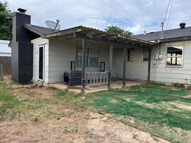 2914 Detroit St, Amarillo, TX 79103 - back of property featuring a chimney and a patio area