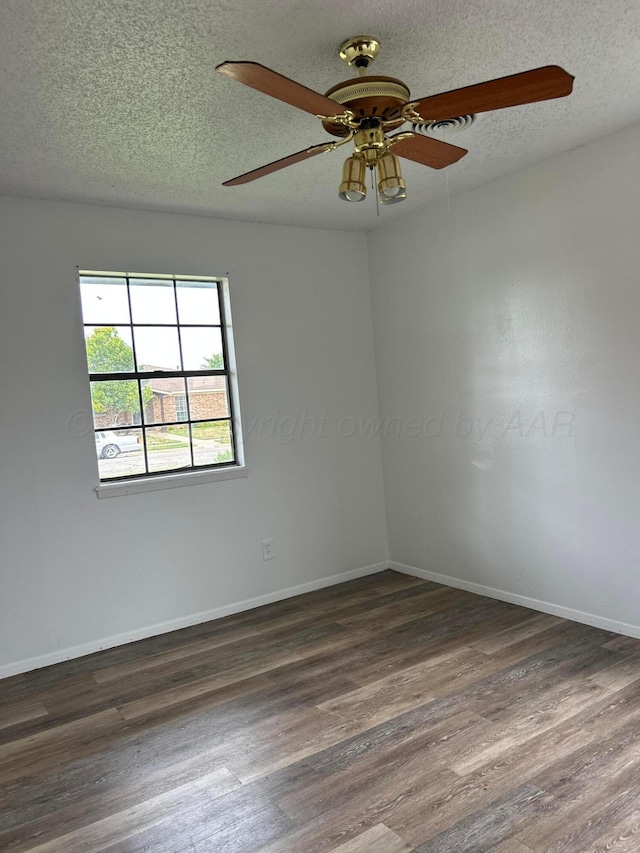 2914 Detroit St, Amarillo, TX 79103 - unfurnished room with dark wood finished floors, a textured ceiling, and ceiling fan