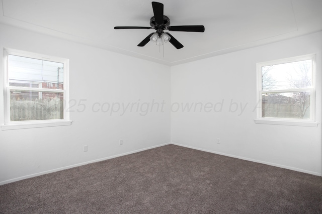 carpeted empty room featuring ceiling fan