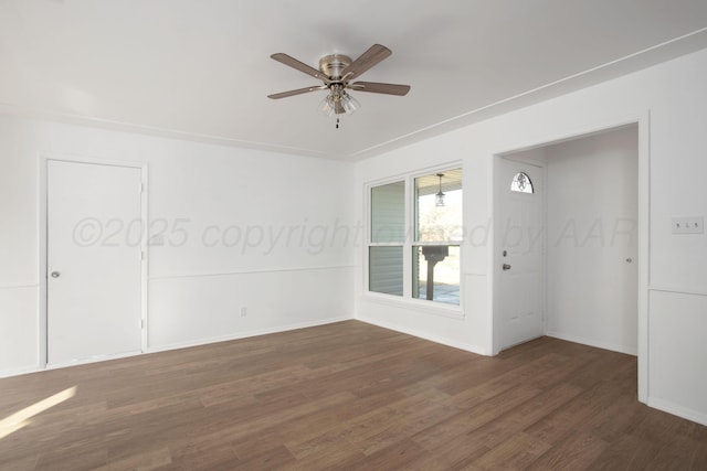 empty room featuring dark hardwood / wood-style floors and ceiling fan