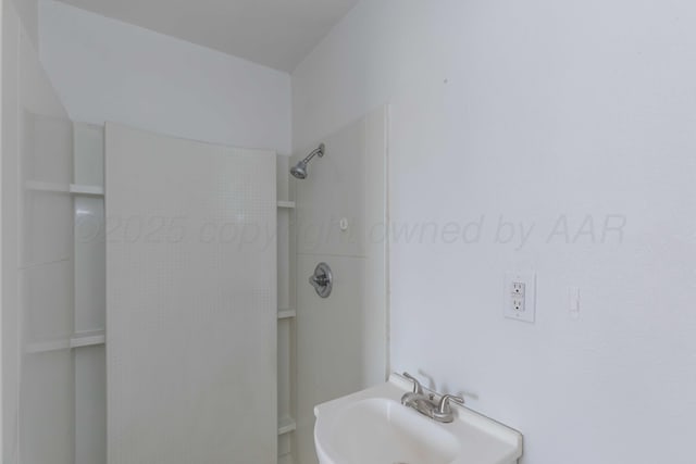 bathroom with sink and a shower