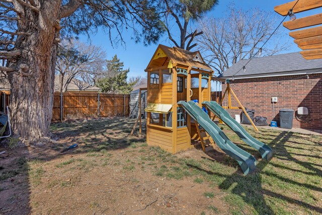 view of jungle gym with fence