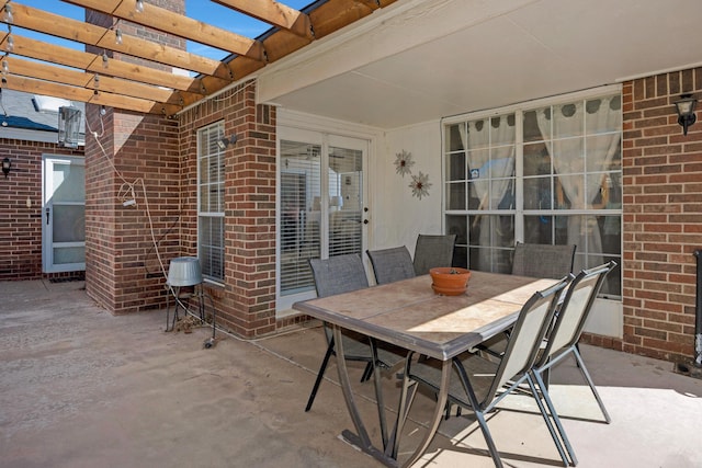 view of patio / terrace with a pergola and outdoor dining space
