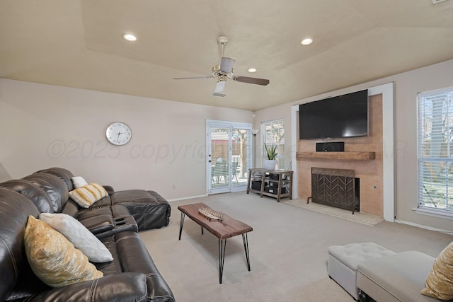 living area featuring carpet flooring, a large fireplace, recessed lighting, baseboards, and a ceiling fan