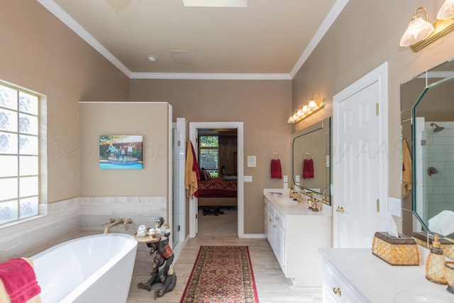 7821 Covington Pkwy, Amarillo, TX 79121 - full bathroom featuring healthy amount of natural light, a freestanding tub, a stall shower, two vanities, and crown molding