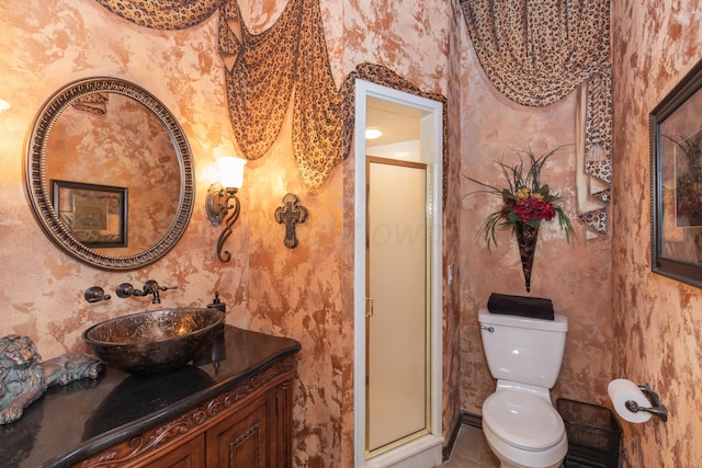 7821 Covington Pkwy, Amarillo, TX 79121 - bathroom with wallpapered walls, vanity, a stall shower, toilet, and tile patterned flooring