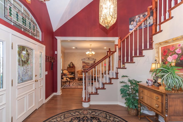 7821 Covington Pkwy, Amarillo, TX 79121 - foyer entrance with a chandelier, high vaulted ceiling, wood finished floors, stairway, and baseboards