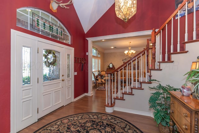 7821 Covington Pkwy, Amarillo, TX 79121 - foyer featuring a chandelier, wood finished floors, stairway, and high vaulted ceiling