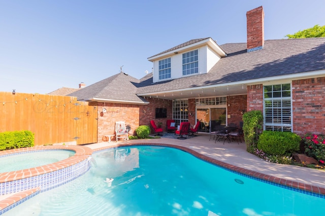 7821 Covington Pkwy, Amarillo, TX 79121 - view of swimming pool featuring a patio area and a pool with connected hot tub