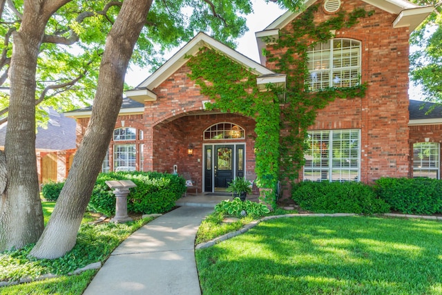 7821 Covington Pkwy, Amarillo, TX 79121 - traditional-style home featuring brick siding and a front lawn