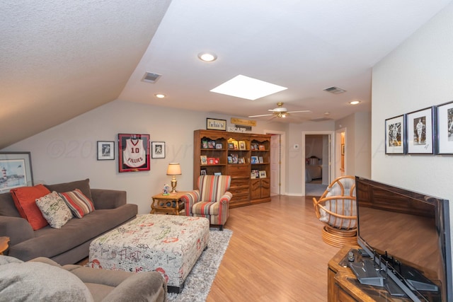 7821 Covington Pkwy, Amarillo, TX 79121 - living area with light wood-type flooring, a skylight, recessed lighting, vaulted ceiling, and ceiling fan