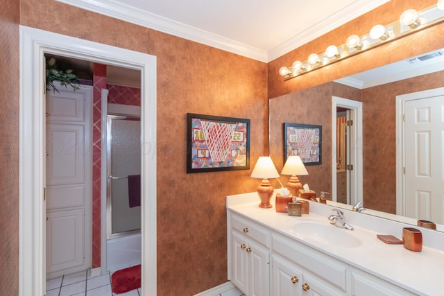 7821 Covington Pkwy, Amarillo, TX 79121 - bathroom with vanity, tile patterned flooring, crown molding, baseboards, and bath / shower combo with glass door