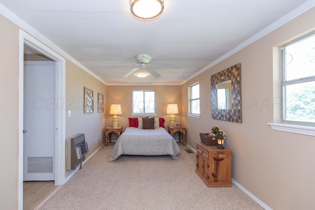 233 Doucette Dr, Howardwick, TX 79226 - bedroom with heating unit, crown molding, light carpet, and ceiling fan