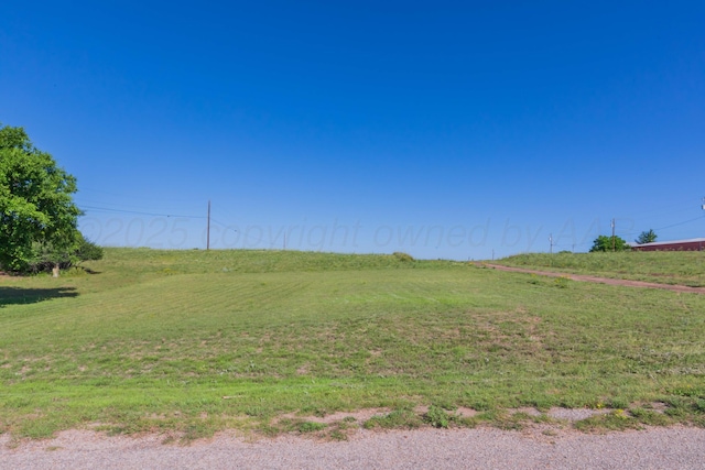 233 Doucette Dr, Howardwick, TX 79226 - view of green lawn featuring a view of rural / pastoral area