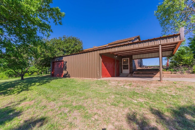 233 Doucette Dr, Howardwick, TX 79226 - view of grassy yard with a wooden deck, an outdoor structure, an outbuilding, and a detached garage