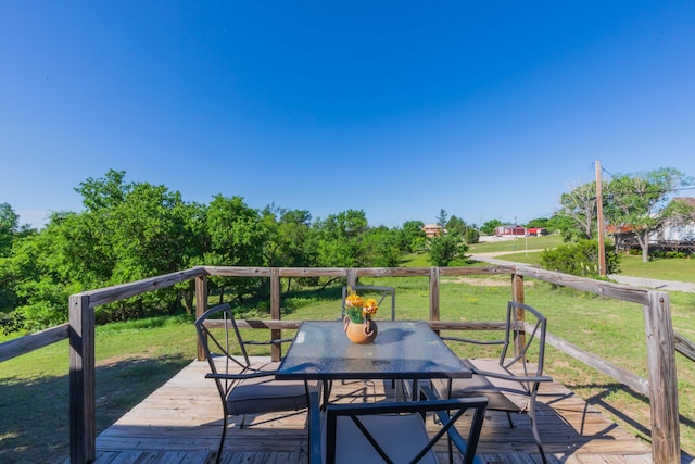 233 Doucette Dr, Howardwick, TX 79226 - wooden terrace featuring outdoor dining space and a yard
