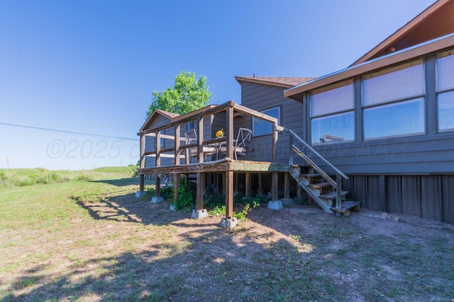 233 Doucette Dr, Howardwick, TX 79226 - back of property featuring stairs and a deck