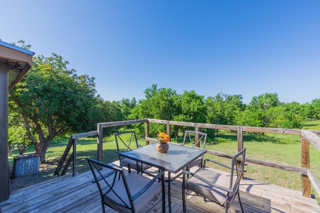 233 Doucette Dr, Howardwick, TX 79226 - deck featuring outdoor dining area and a lawn