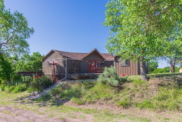 233 Doucette Dr, Howardwick, TX 79226 - back of property featuring a deck and board and batten siding