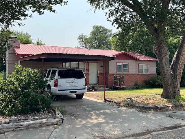 ranch-style home with a carport