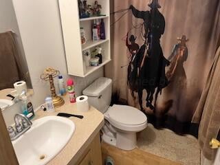 bathroom featuring toilet and sink