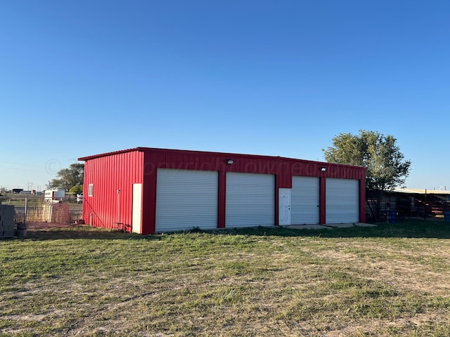 garage with a lawn