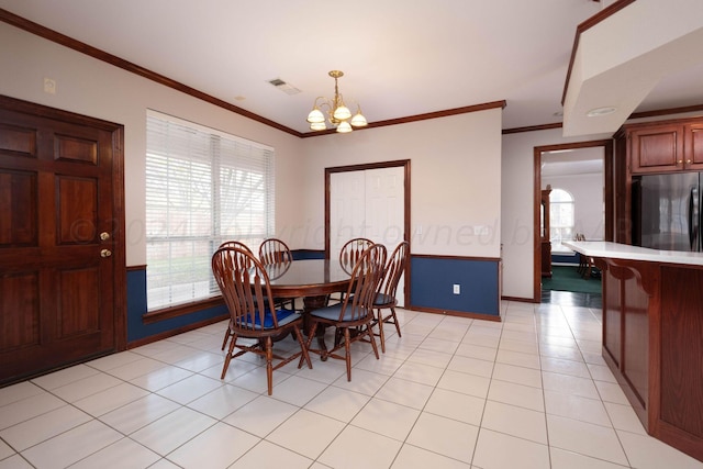 4502 Chesapeake Pl, Amarillo, TX 79119 - dining area with a chandelier, crown molding, baseboards, and light tile patterned flooring