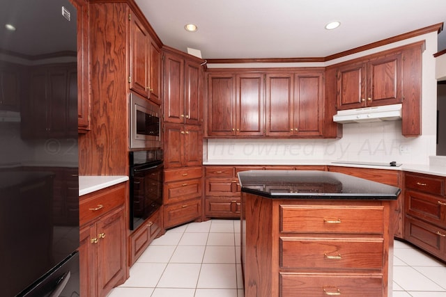 4502 Chesapeake Pl, Amarillo, TX 79119 - kitchen featuring black oven, under cabinet range hood, stainless steel microwave, light tile patterned floors, and electric cooktop