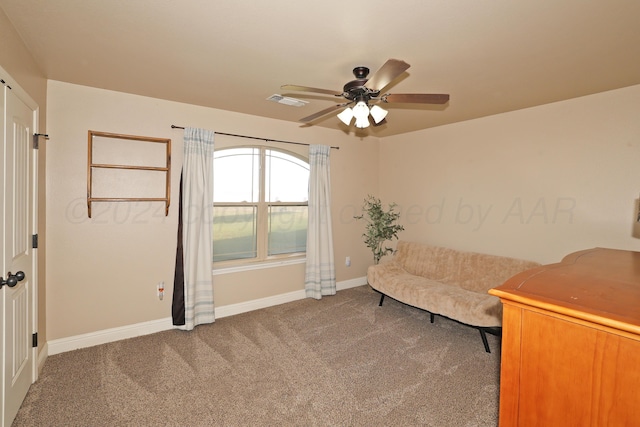 unfurnished room with baseboards, carpet flooring, ceiling fan, and visible vents