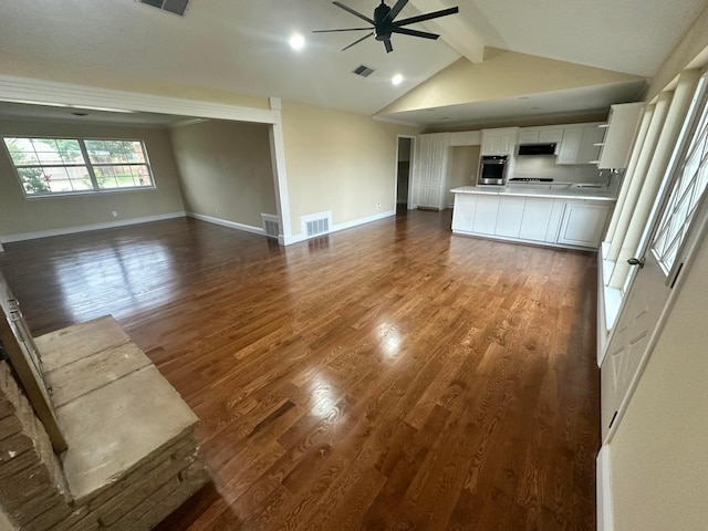 107 Galahad St, Borger, TX 79007 - unfurnished living room with ceiling fan, baseboards, and dark wood-style floors