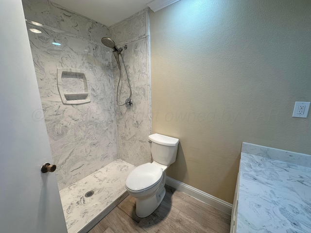 107 Galahad St, Borger, TX 79007 - full bath featuring toilet, a stall shower, and wood finished floors