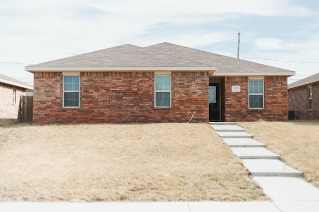 ranch-style house with central AC unit