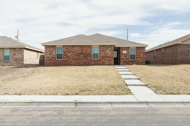 ranch-style house with a front yard