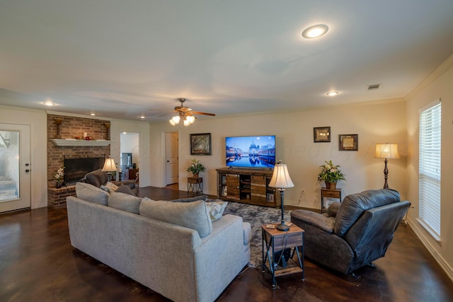 living room with visible vents, ornamental molding, recessed lighting, a fireplace, and baseboards