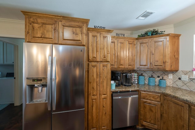 kitchen with light stone counters, visible vents, ornamental molding, decorative backsplash, and appliances with stainless steel finishes